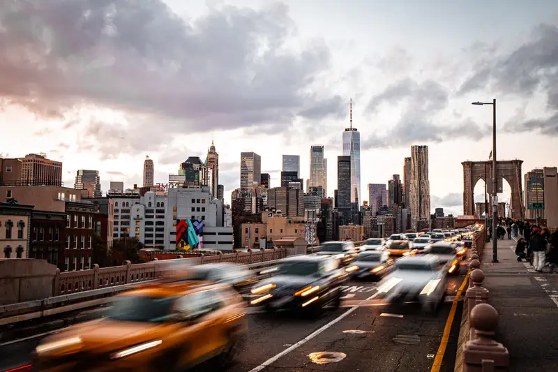 Traffic on the Brooklyn Bridge, with the Manhattan skyline behind. Photograph by Stefano Paolucci